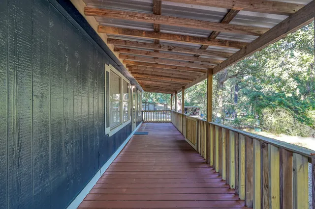 a view of balcony with wooden floor