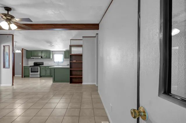 a kitchen with a refrigerator and a sink