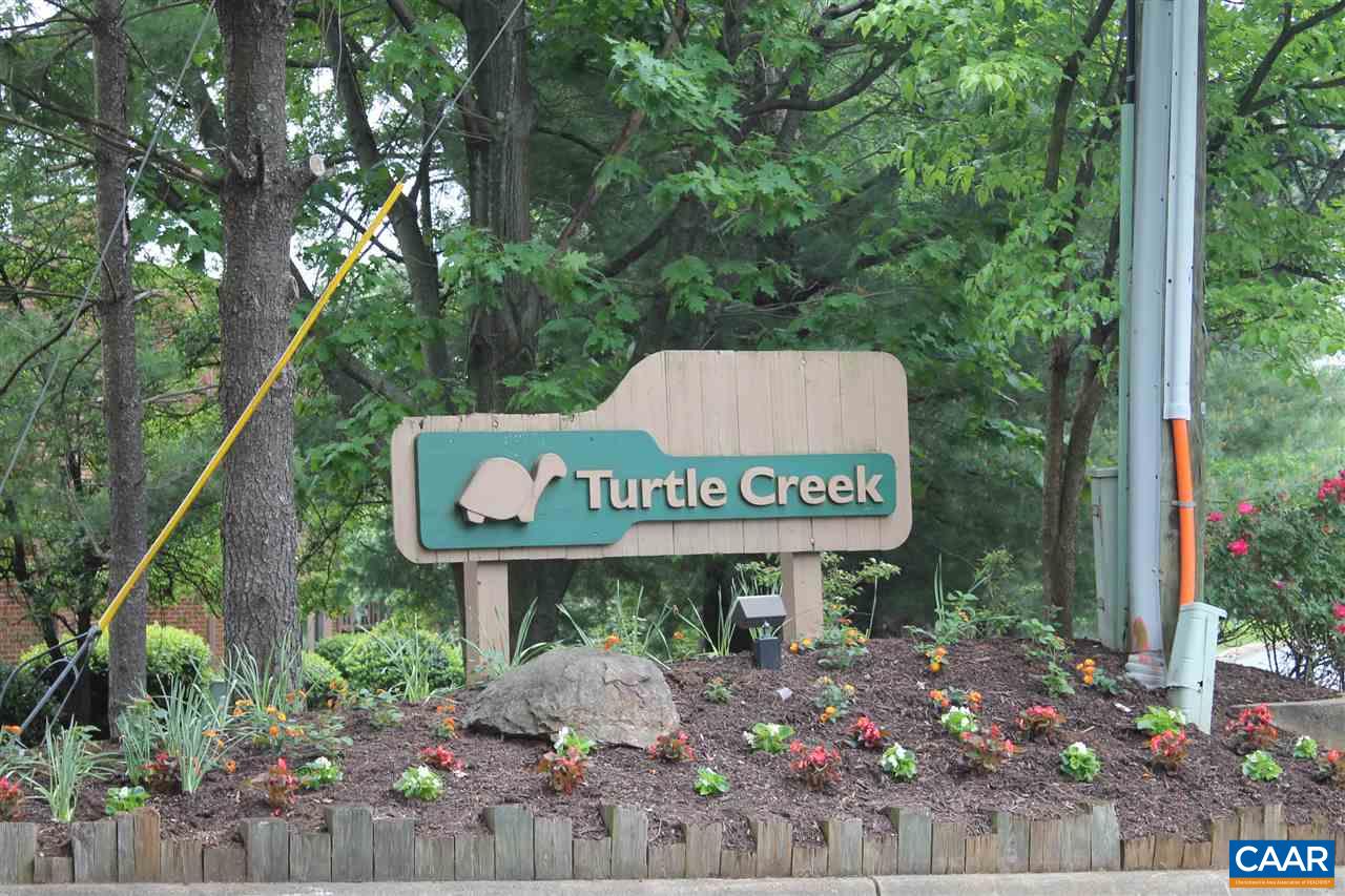 101 Turtle Creek Road, Unit 6 Charlottesville, VA 22901 - Photo 1 of 5 a sign on the side of a tree