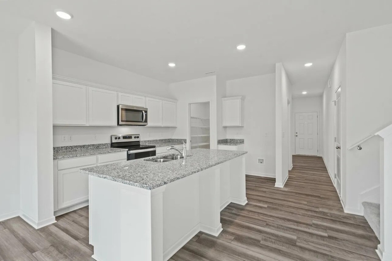3103 Diamond Vw Lane Angleton, TX 77515 - Photo 3 of 17 a view of a kitchen with granite countertop lots of counter top space and stainless steel appliances