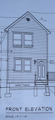 a view of a brick house with large windows