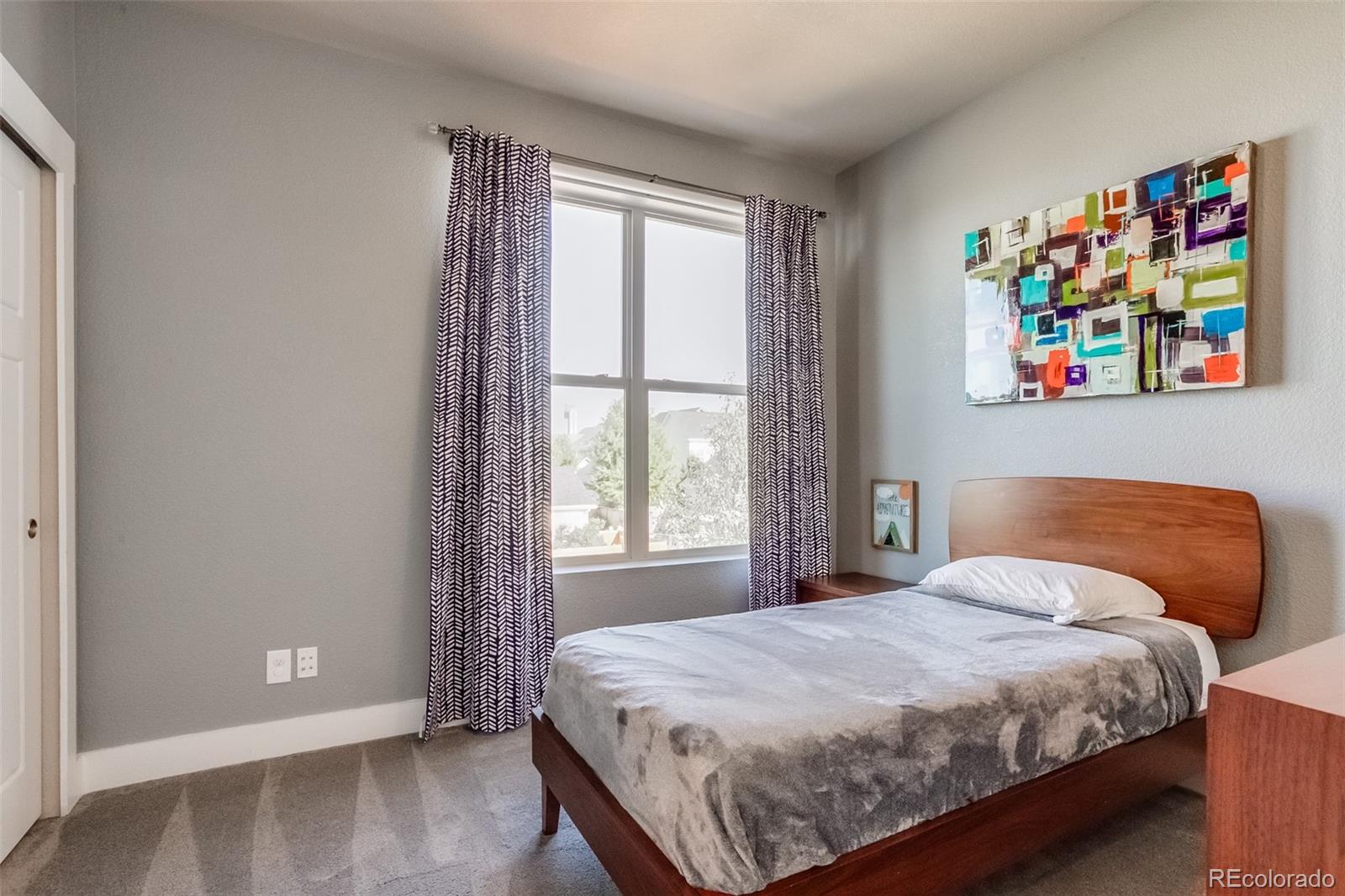 3219 Spruce Street Denver, CO 80238 - Photo 29 of 50 a bedroom with a bed and a window