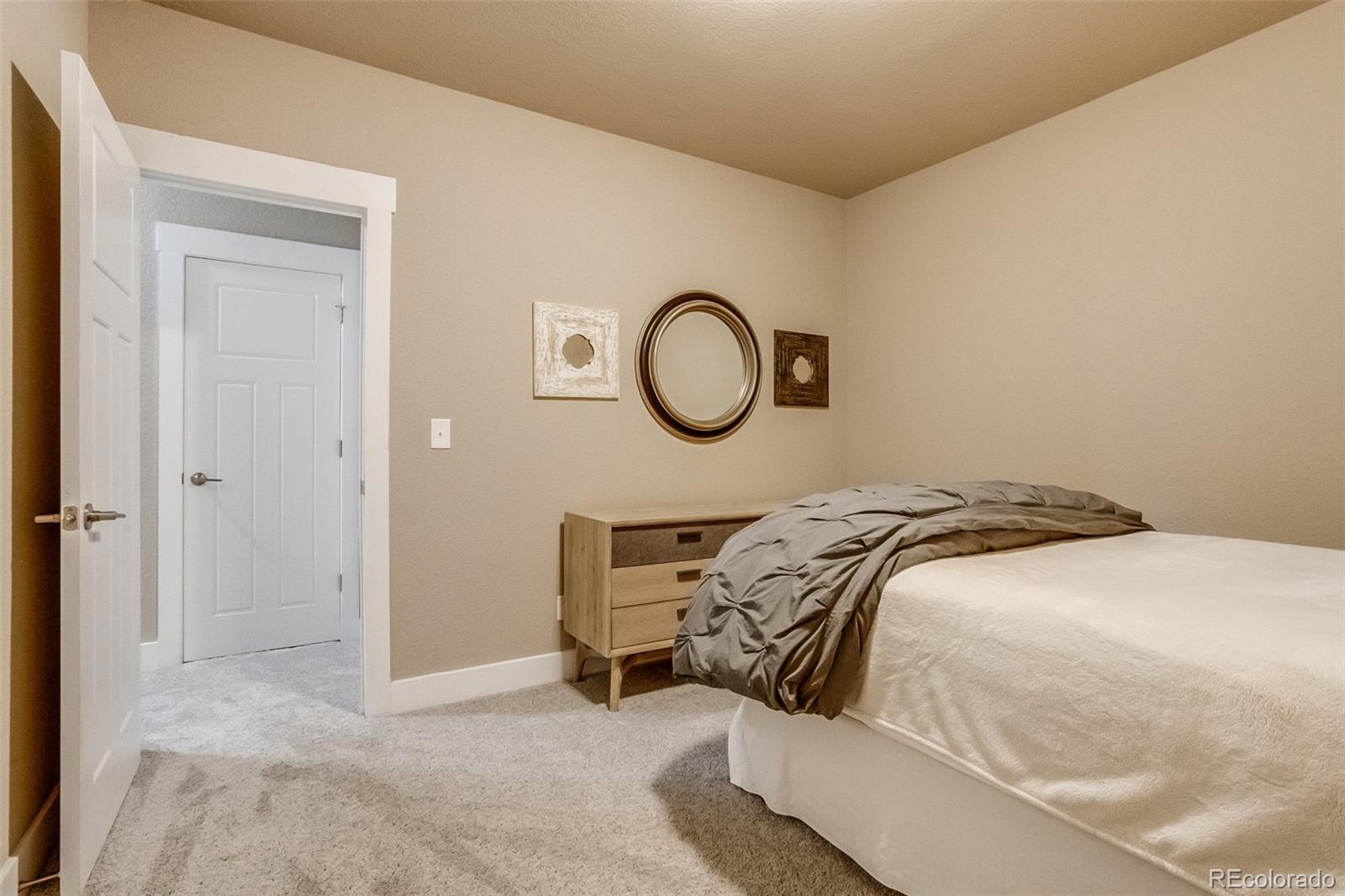 3219 Spruce Street Denver, CO 80238 - Photo 43 of 50 a bedroom with a bed and a window