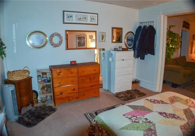 a bedroom with a bed and cabinets