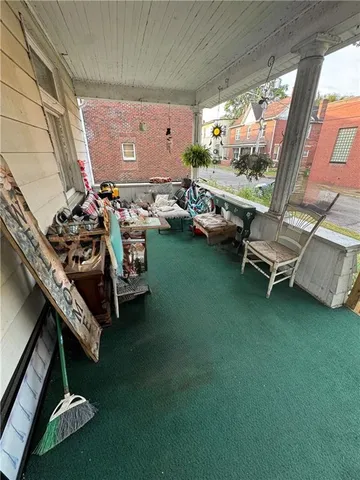 a view of a room with furniture and a window