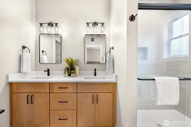 a bathroom with a sink vanity and a mirror