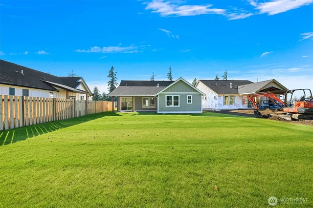 a view of house with outdoor space and sitting area