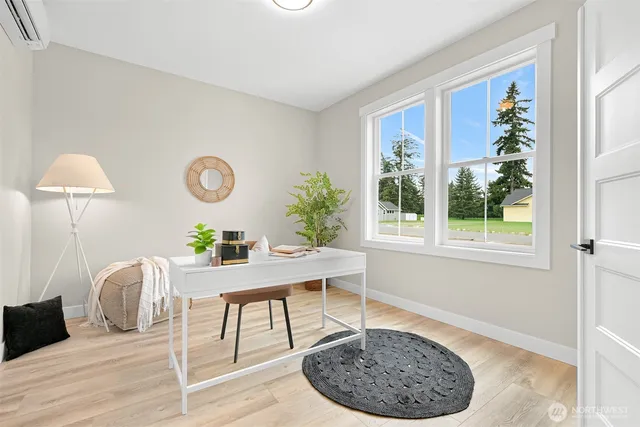 a workspace with furniture and window