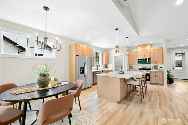 a view of a dining room with furniture window and wooden floor