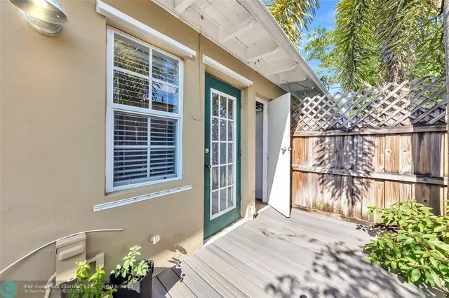 a view of a house with a window and wooden floor