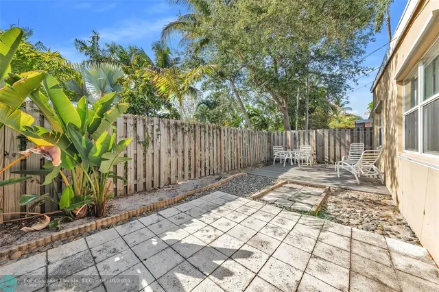 a view of a backyard with a trees