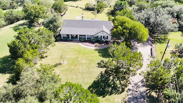125 Kyle Lane Georgetown, TX 78633 - Photo 5 of 34 View of subject property with a tree filled landscape