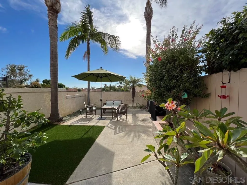 6805 Maple Leaf Drive Carlsbad, CA 92011 - Photo 17 of 22 a view of a backyard with sitting area