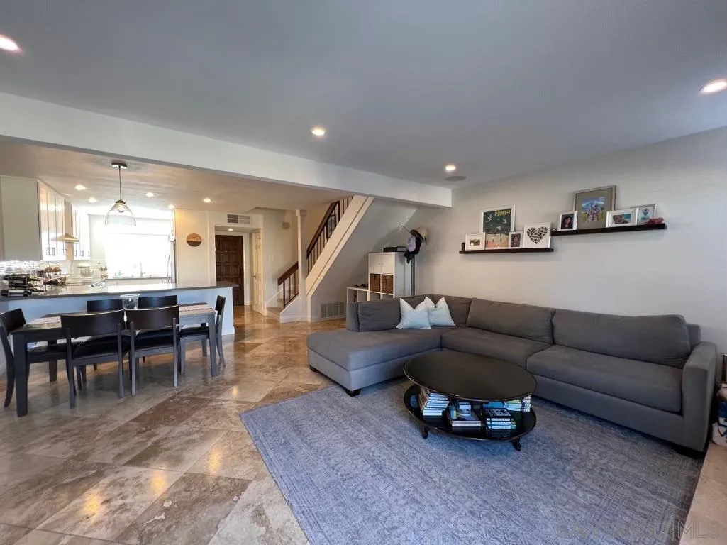 6805 Maple Leaf Drive Carlsbad, CA 92011 - Photo 3 of 22 a living room with furniture and a wooden floor
