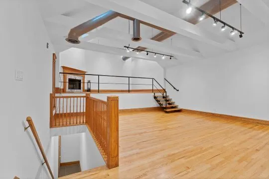 a view of an entryway with wooden floor