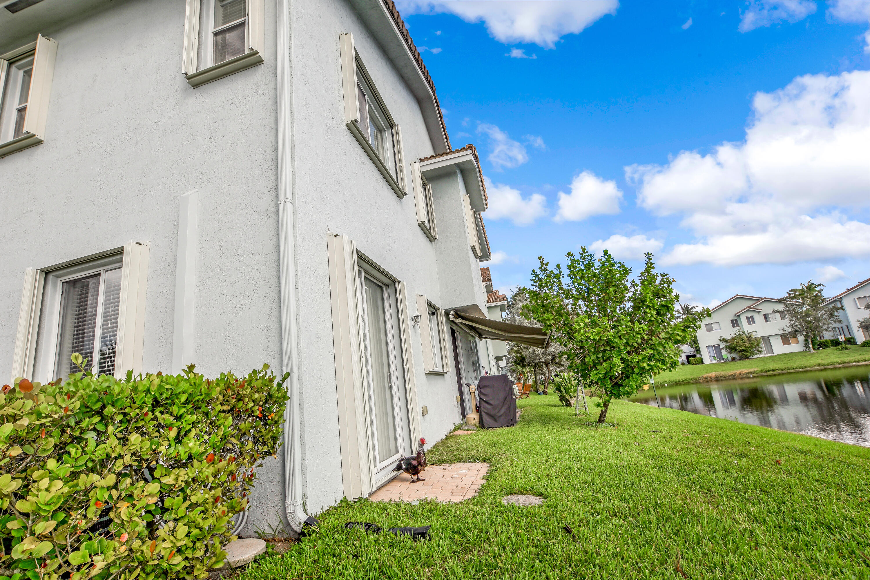 3268 Laurel Ridge Circle Riviera Beach, FL 33404 - Photo 23 of 33 Backyard Patio