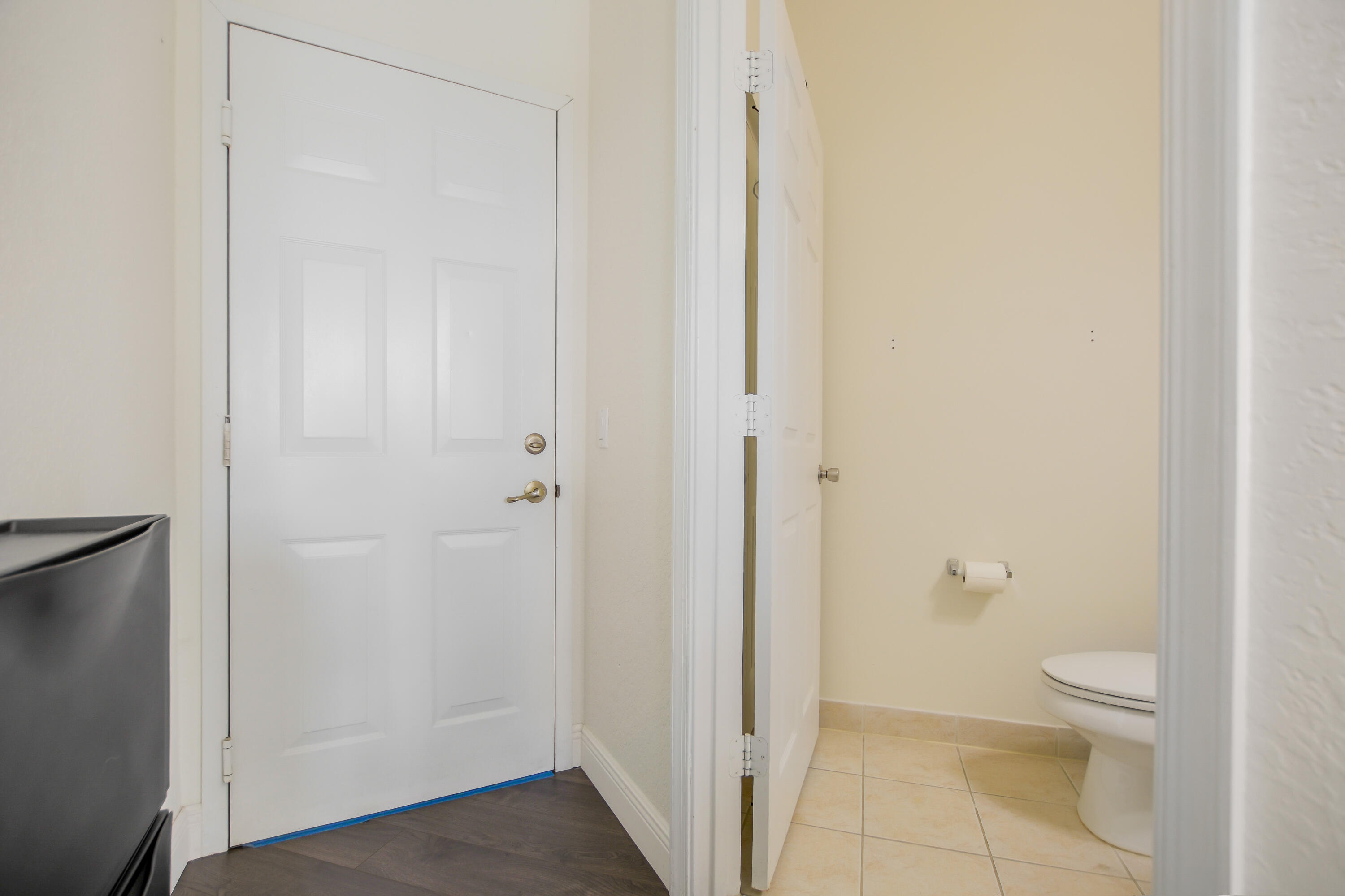 3268 Laurel Ridge Circle Riviera Beach, FL 33404 - Photo 10 of 33 Downstairs half bath and garage door