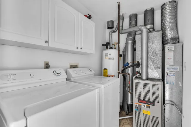 a view of a house with a garage and yard