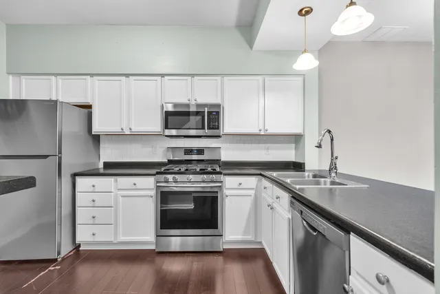 a kitchen with a stove and a microwave