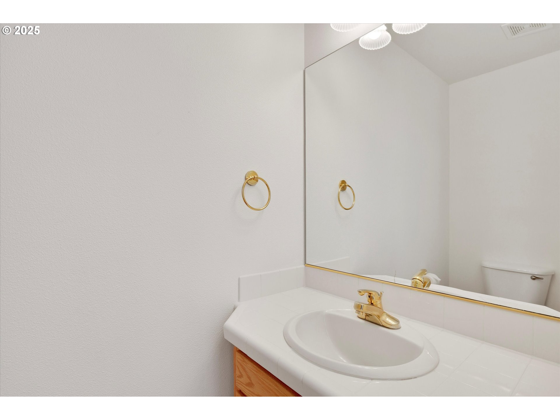 1380 Southeast 9th Avenue Canby, OR 97013 - Photo 10 of 21 a bathroom with a sink and a mirror