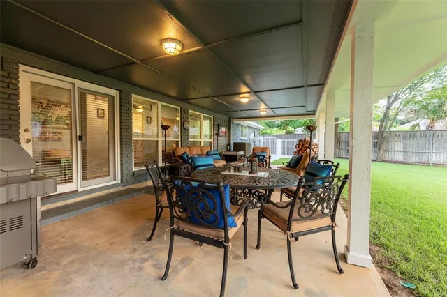 a view of a livingroom with furniture and windows