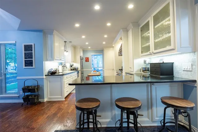 a kitchen with a sink and a refrigerator