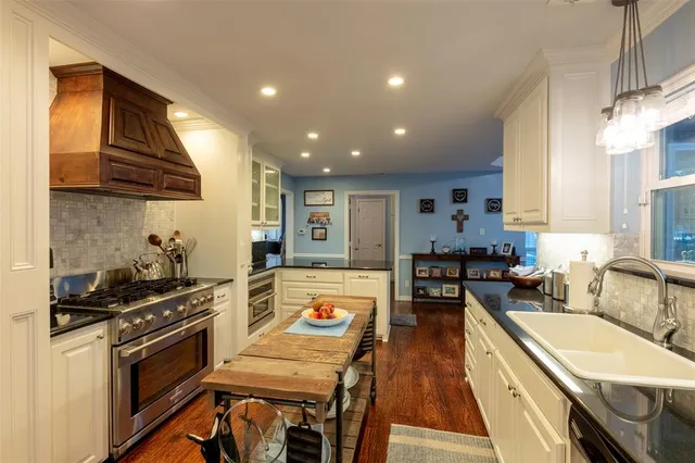 a view of a hallway with a large window with wooden floor