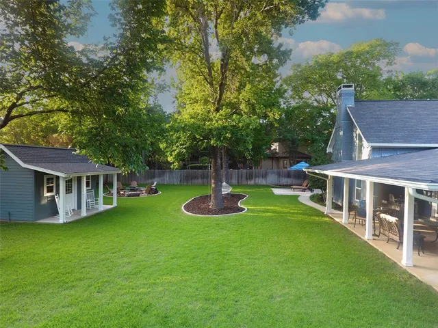 an aerial view of a house with garden space and lake view