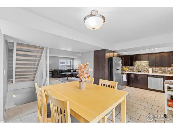 a kitchen with a table and chairs in it