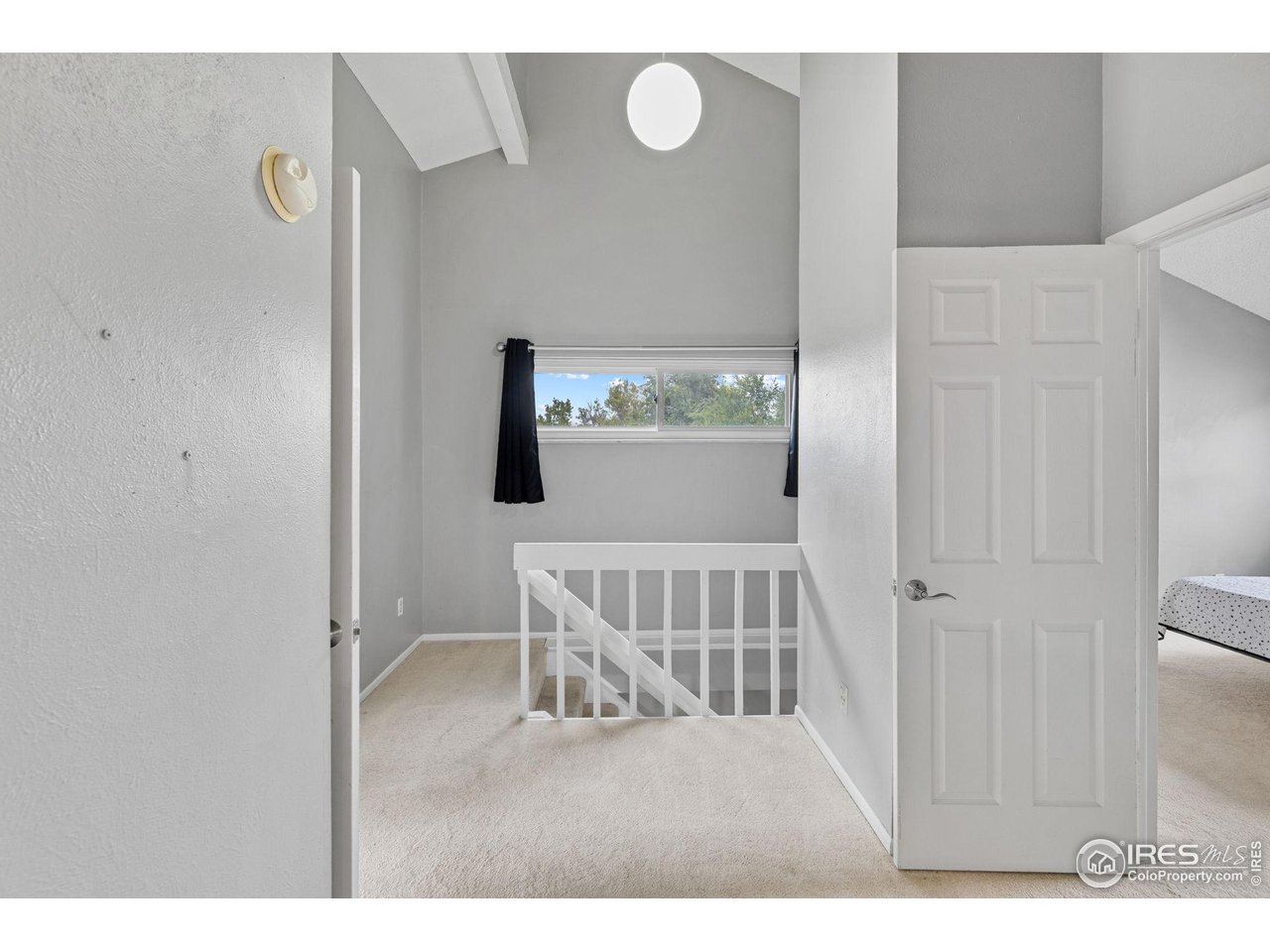 4216 East Maplewood Way Centennial, CO 80121 - Photo 18 of 46 a view of a bedroom with wooden floor