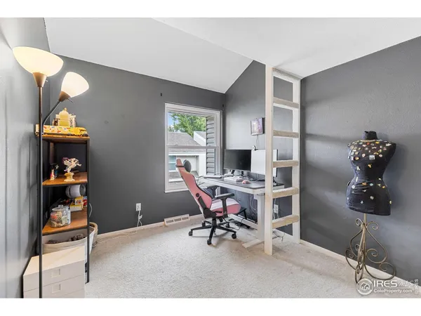 a workspace with furniture and window