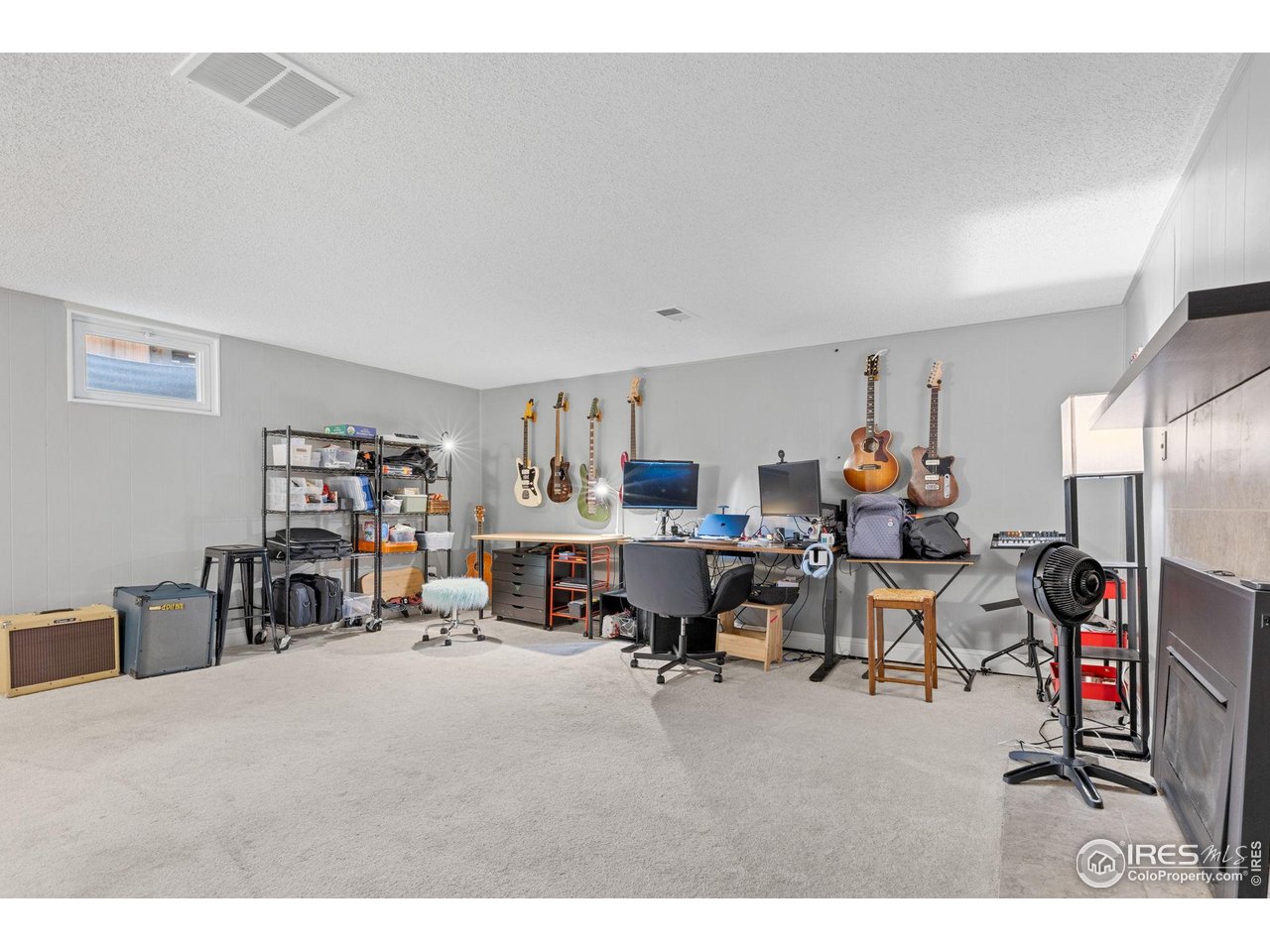 4216 East Maplewood Way Centennial, CO 80121 - Photo 32 of 46 a living room with furniture and a dining table