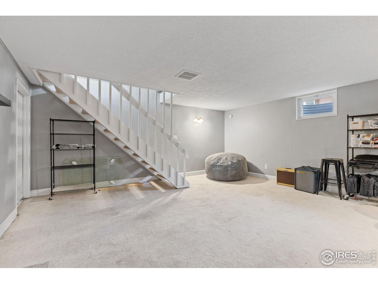 4216 East Maplewood Way Centennial, CO 80121 - Photo 35 of 46 a view of a livingroom with furniture and staircase