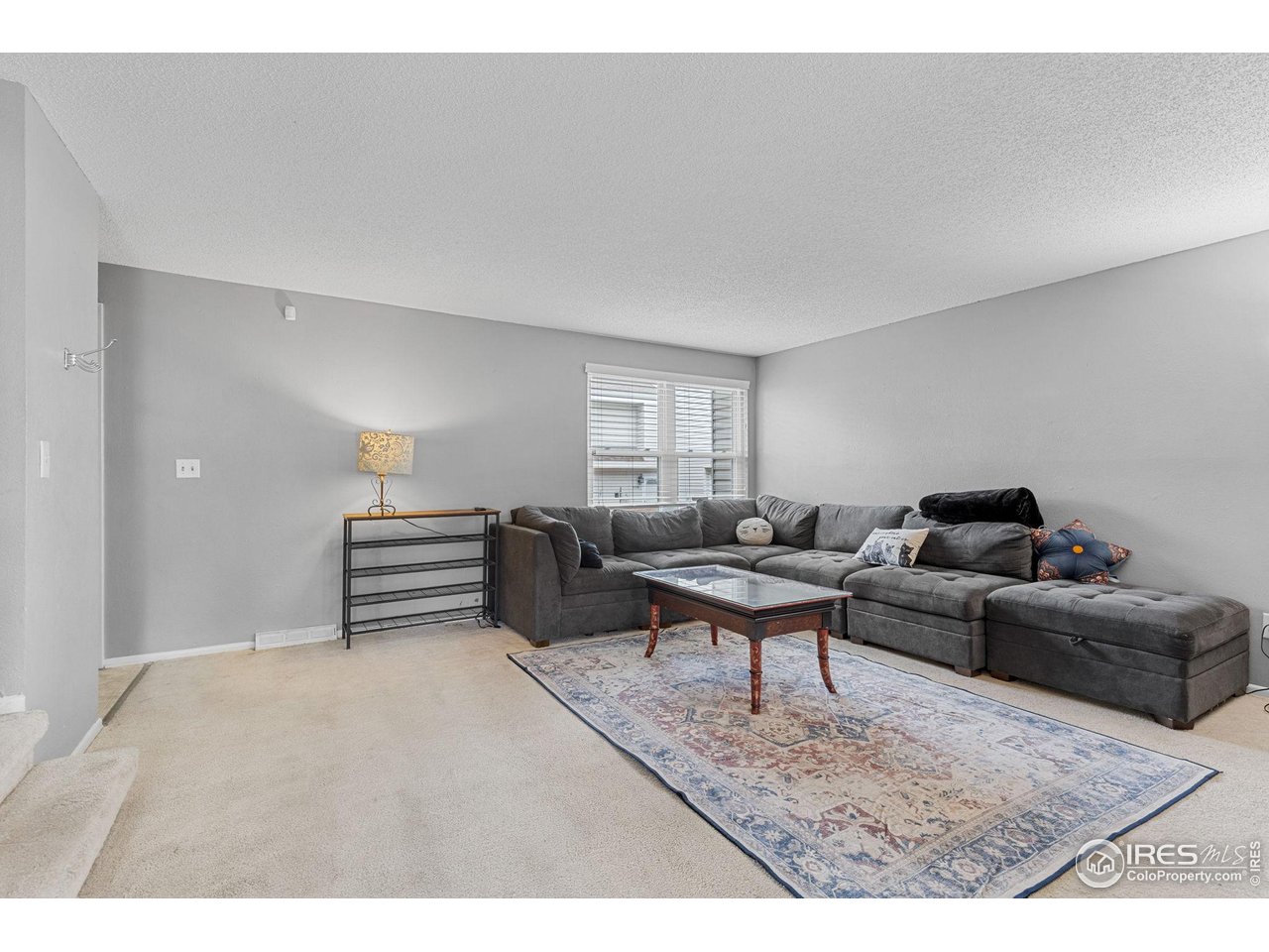 4216 East Maplewood Way Centennial, CO 80121 - Photo 6 of 46 a living room with furniture and a wooden floor