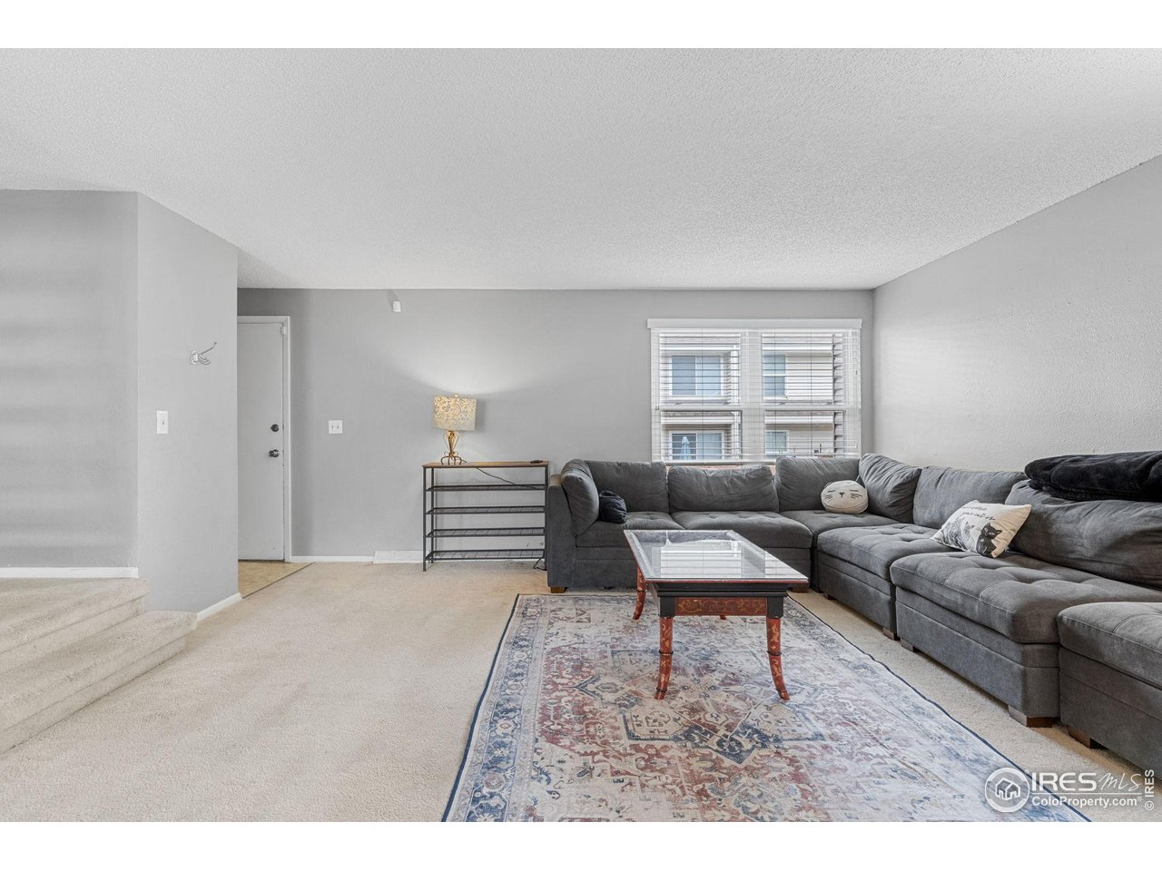 4216 East Maplewood Way Centennial, CO 80121 - Photo 7 of 46 a living room with furniture and a window