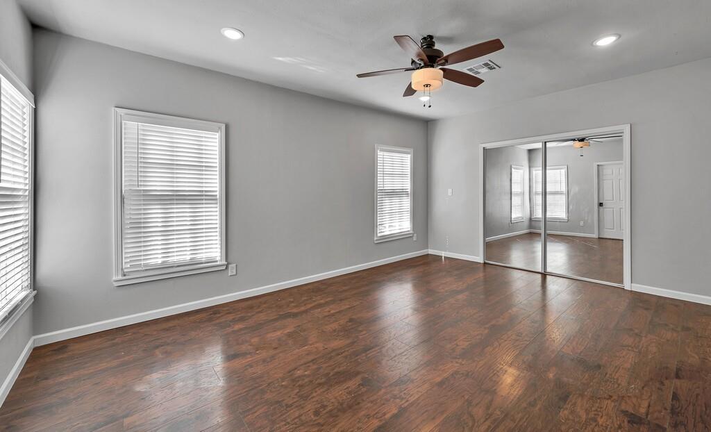 2001 Colcord Avenue Waco, TX 76707 - Photo 15 of 26 a view of empty room with wooden floor and fan