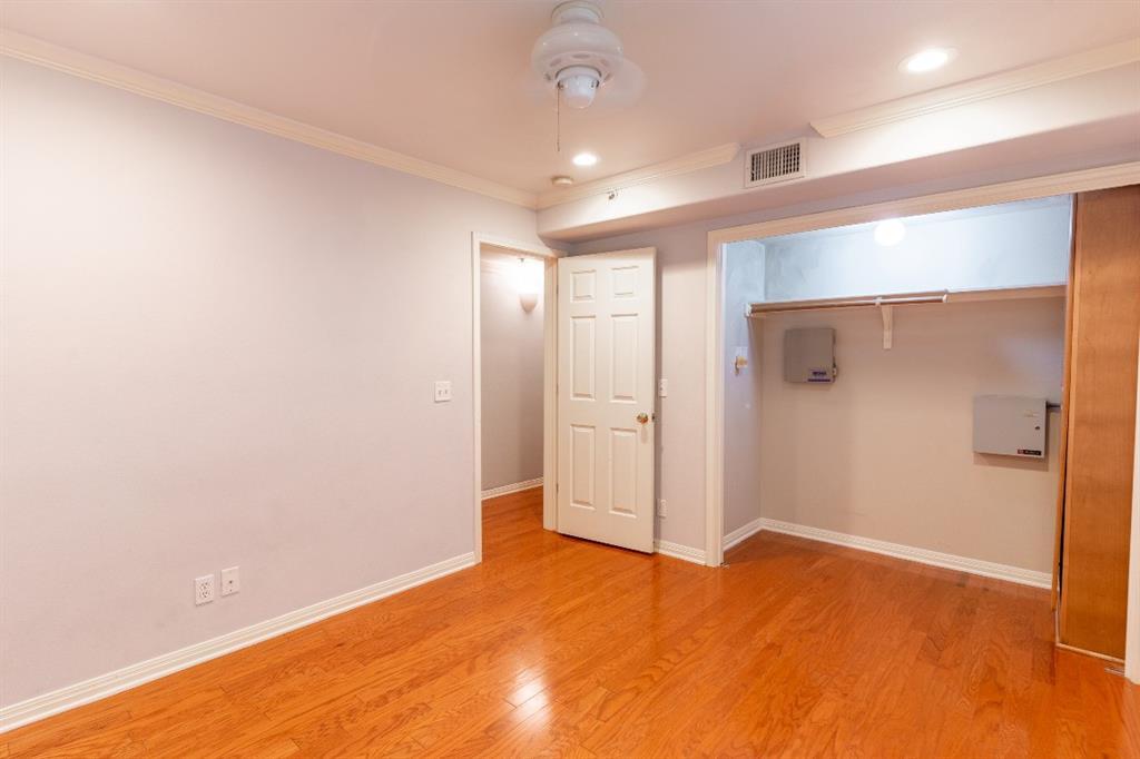 3009 Speedway, Unit 2 Austin, TX 78705 - Photo 6 of 10 Hardwood floors and bright recessed lighting illuminate this adaptable space.