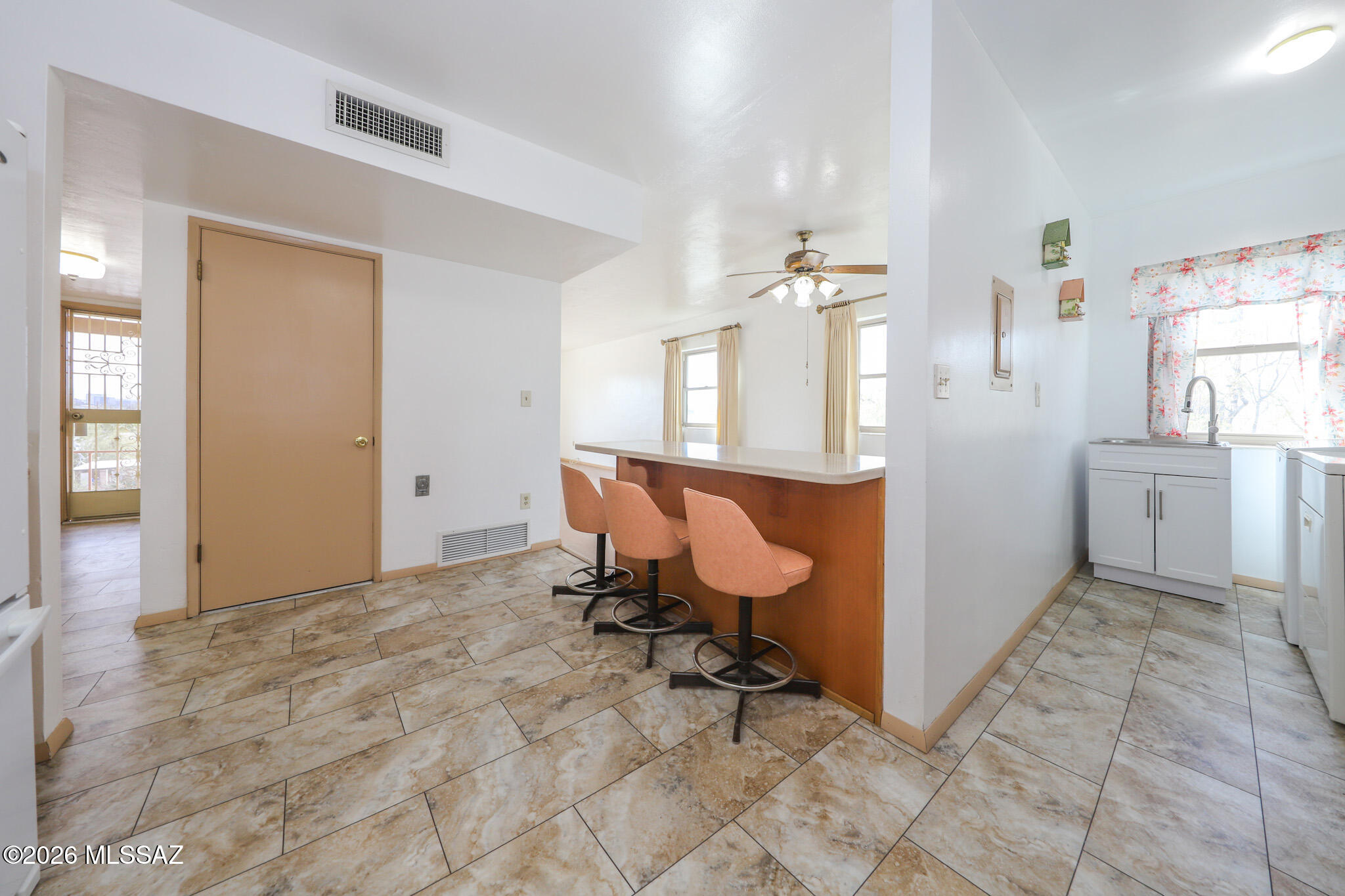 37 North Silverbell Road Tucson, AZ 85745 - Photo 11 of 31 a view of a room with window and wooden floor
