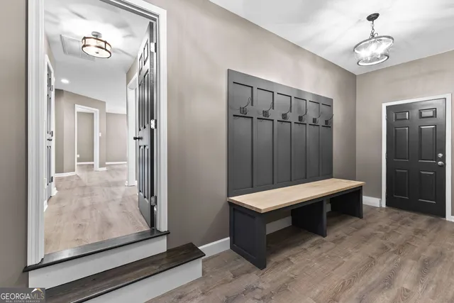 a room with pool table and glass door