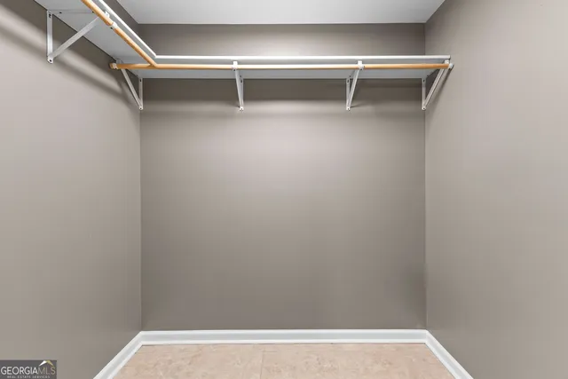 a view of an empty walk in closet
