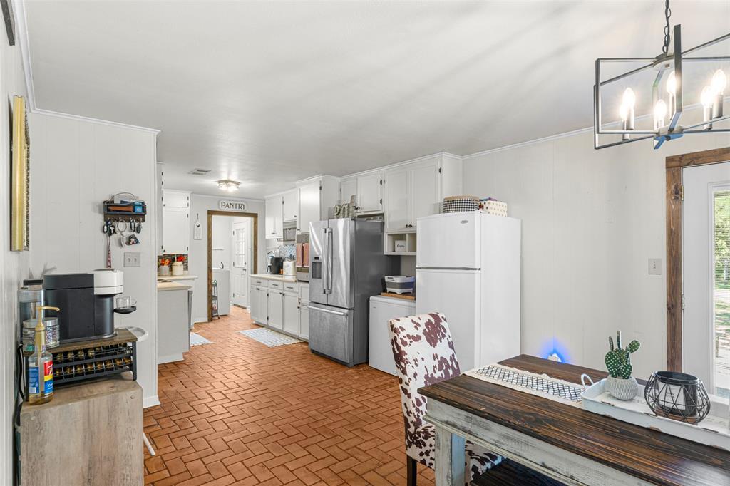 602 Colonial Drive Athens, TX 75751 - Photo 27 of 39 Kitchen with brick floors