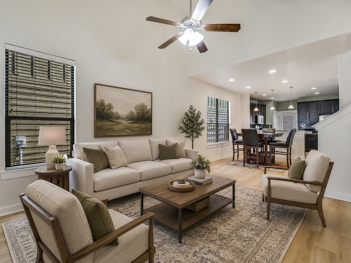 2101 Rivers Edge Way, Unit 29 Austin, TX 78741 - Photo 4 of 38 Virtually Staged. Vaulted living area featuring wood-finish flooring, a ceiling fan, and large windows with blinds