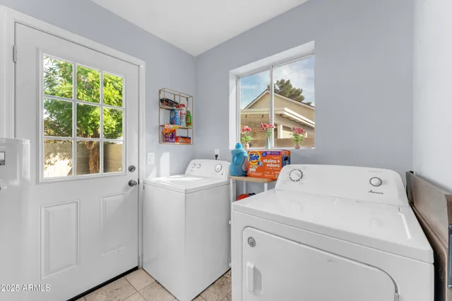 a utility room with dryer and washer