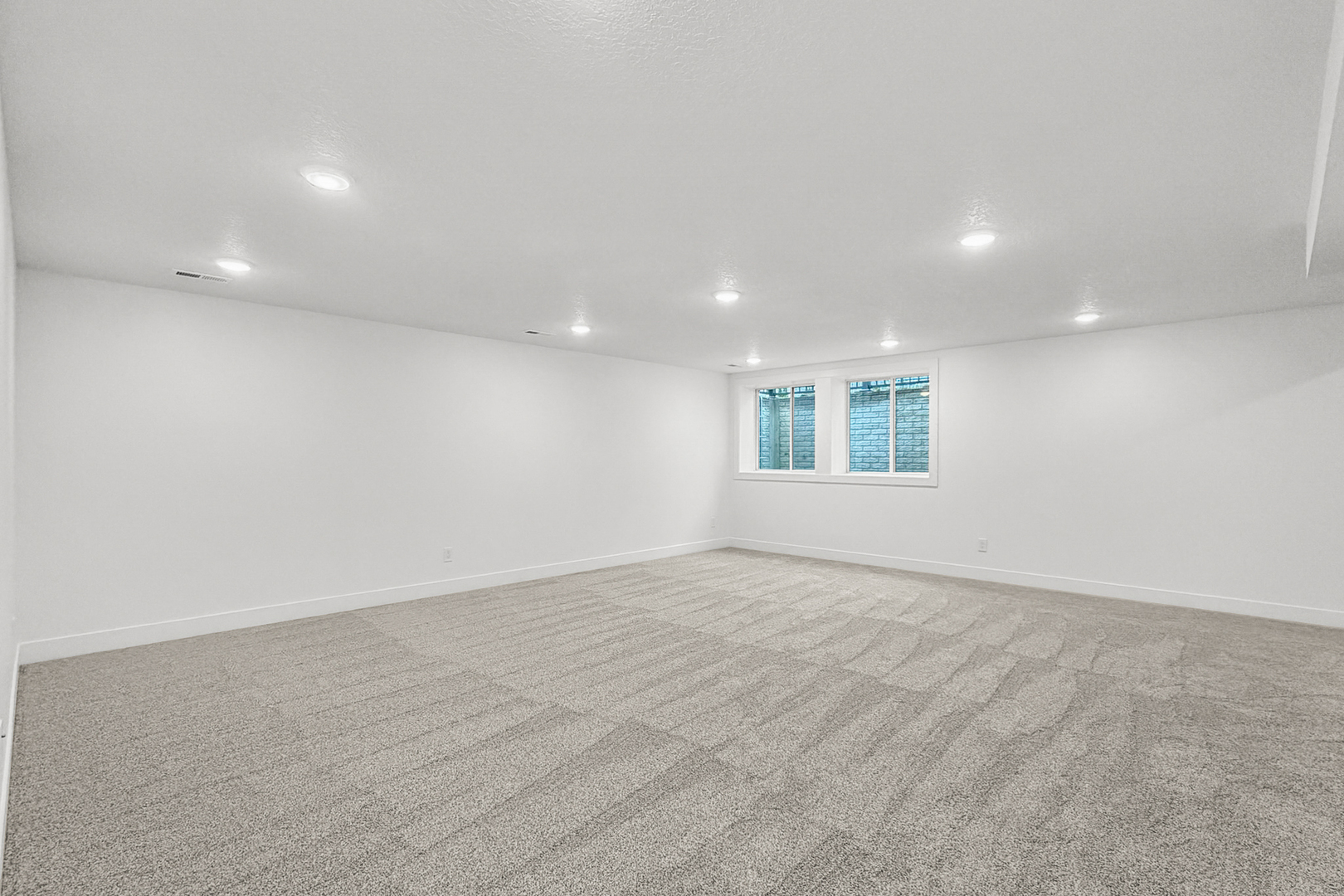 606 Kevin Road Blue Grass, IA 52726 - Photo 9 of 33 an empty room with windows