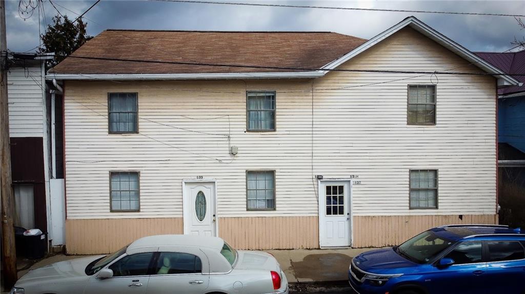 135 Hickory Street Butler, PA 16001 - Photo 1 of 25 a front view of a house with cars parked