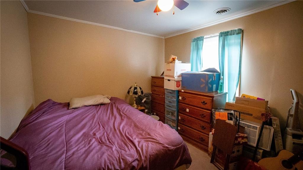 135 Hickory Street Butler, PA 16001 - Photo 15 of 25 a bed sitting in a bedroom next to a window