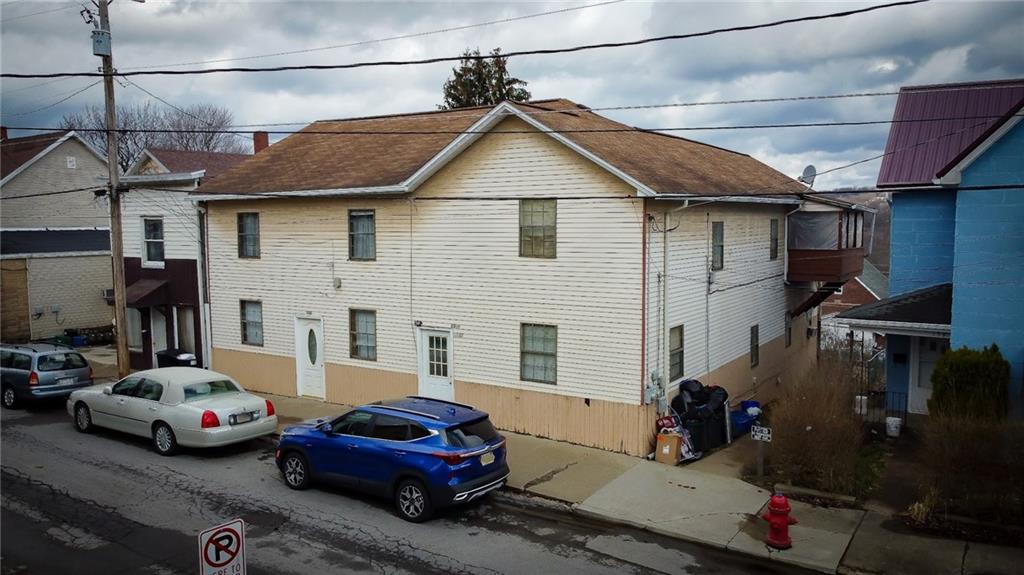 135 Hickory Street Butler, PA 16001 - Photo 3 of 25 a view of a street with cars