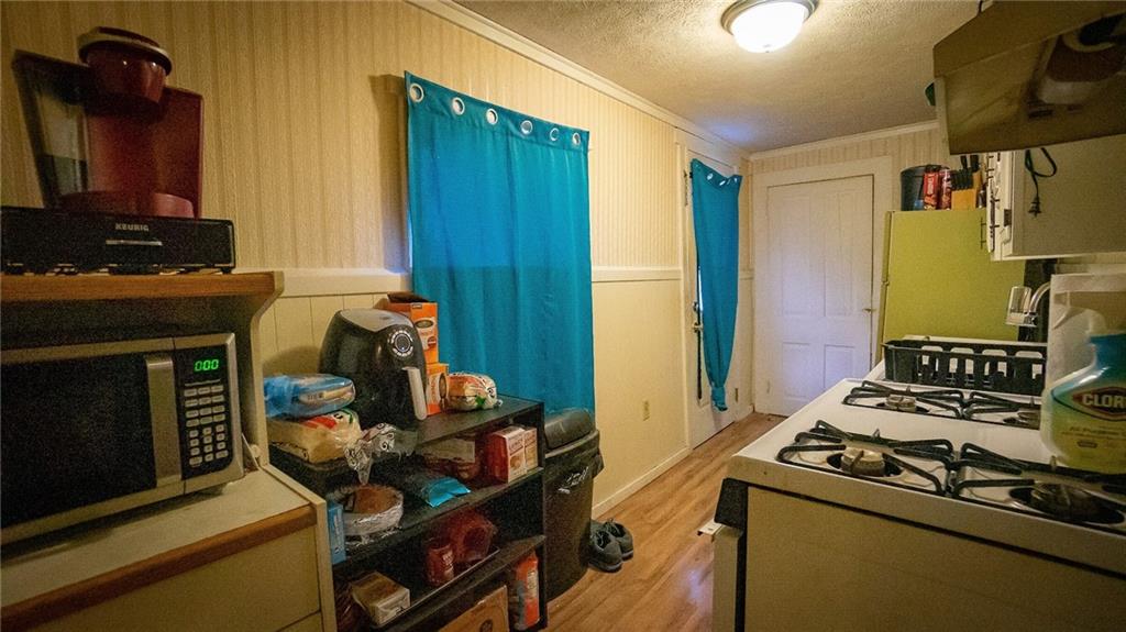 135 Hickory Street Butler, PA 16001 - Photo 5 of 25 a kitchen with a stove and a refrigerator