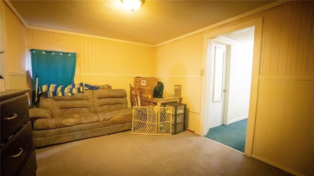 135 Hickory Street Butler, PA 16001 - Photo 7 of 25 a living room with furniture and a flat screen tv