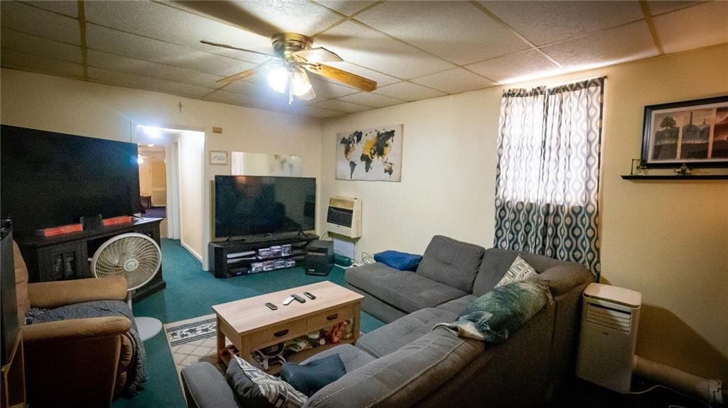 135 Hickory Street Butler, PA 16001 - Photo 9 of 25 a living room with furniture and a flat screen tv